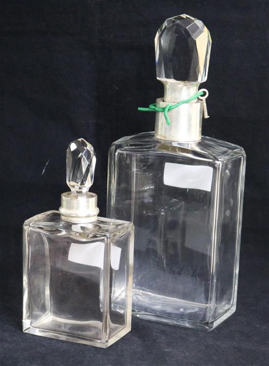 A silver mounted glass locking decanter by Hukin & Heath, Birmingham, 1934 and a smaller silver mounted decanter, Birmingham, 1926,